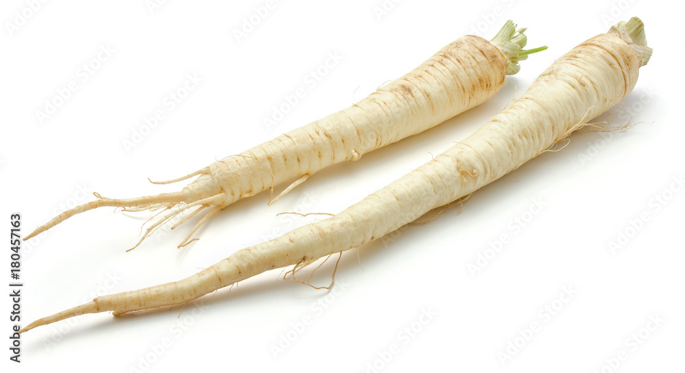 Two whole parsley root isolated on white background. Two whole parsley root isolated on white background.