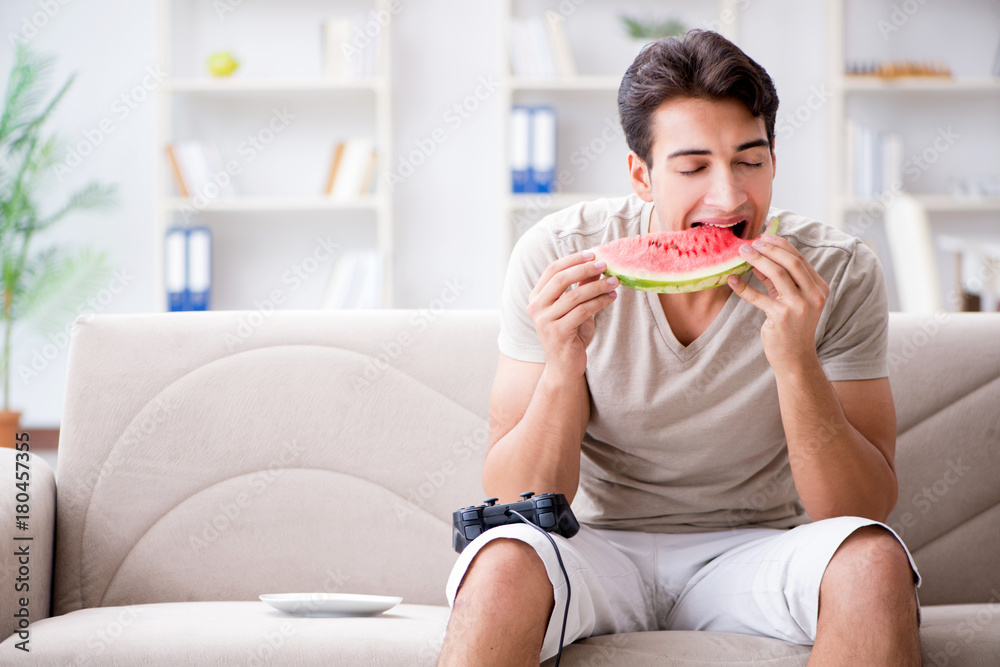 Man eating watermelon at home Man eating watermelon at home