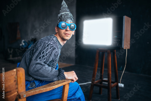 Man in tinfoil helmet and hypnotizing glasses, UFO