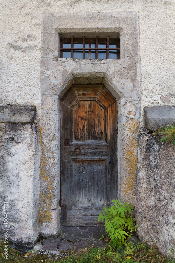 The old wooden door of the church. Rear entrance.