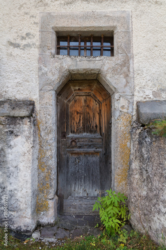 The old wooden door of the church. Rear entrance.