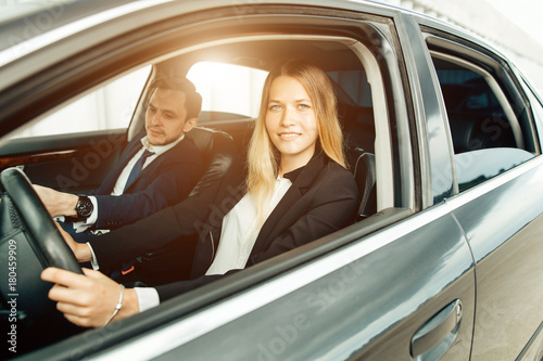 Driving School - woman steer car with steering wheel, maybe she has driving test photo