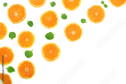 Slices of orange or tangerine with leaves isolated on white background with copy space for your text. Flat lay, top view