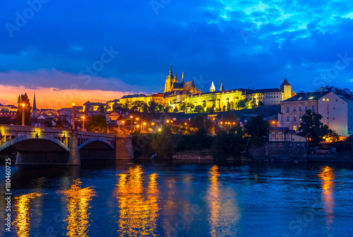 Prague Castle in Prague, in the Czech Republic in the evening at sunset. Beautifully highlighted Manes bridge and Prague Castle