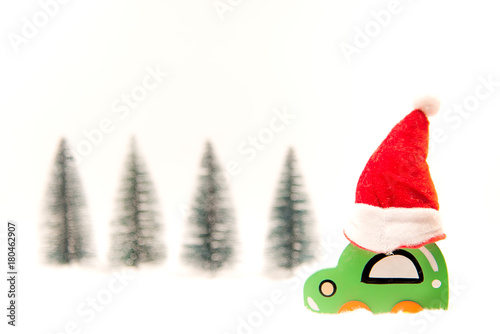 Christmas red jat on wood toy car on the snow. Christmas holiday celebration concept