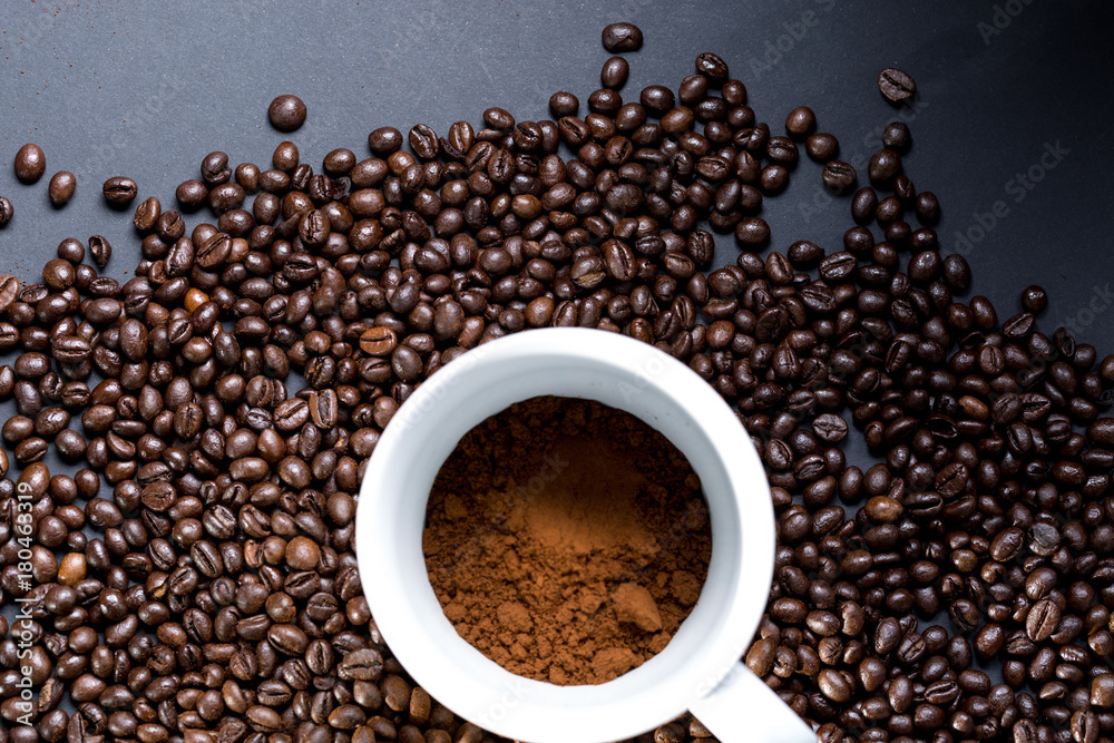 Mug of coffee and grains all around. View from top to flat lying. Mug of coffee and grains all around. View from top to flat lying.