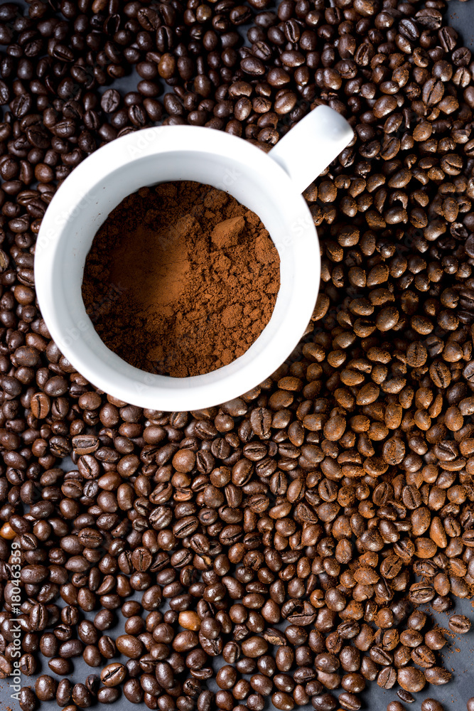 Mug of coffee and grains all around. View from top to flat lying. Mug of coffee and grains all around. View from top to flat lying.