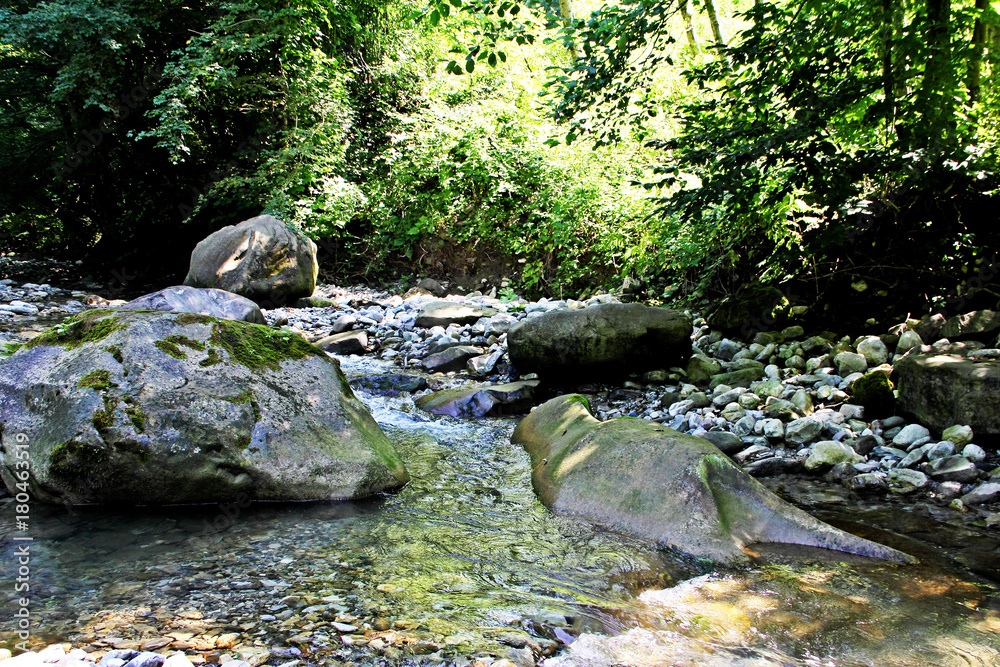 Big stones in mountain river.