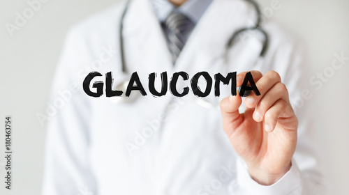 Doctor writing word GLAUCOMA with marker, Medical concept photo