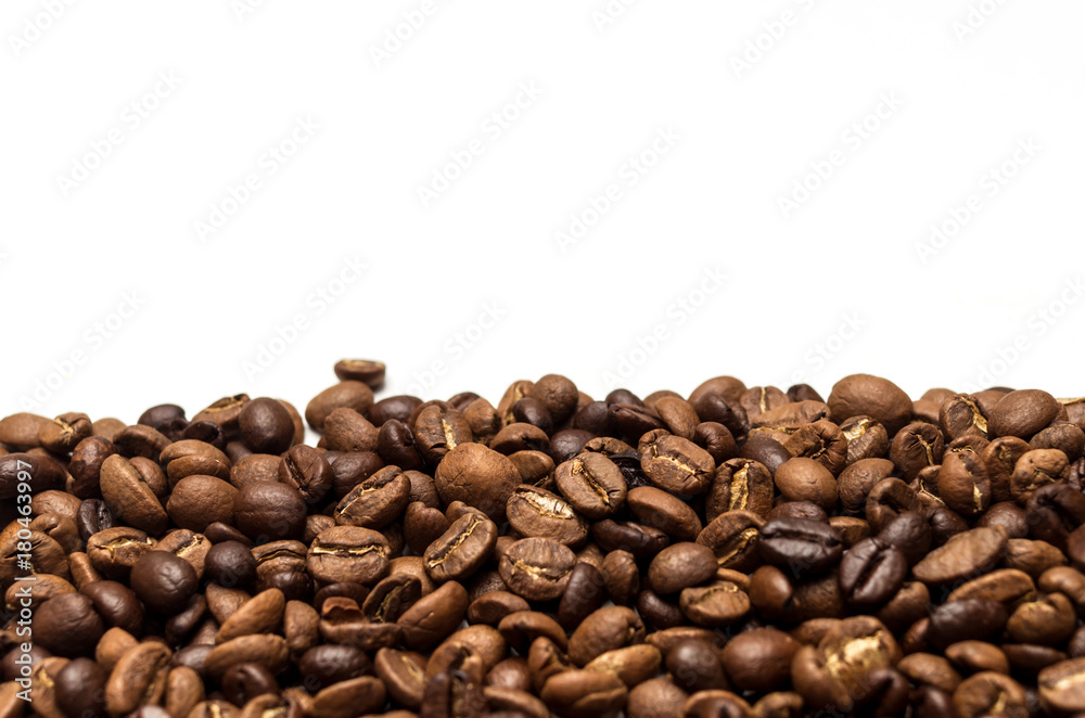Roasted coffee beans isolated on white background, copy space Roasted coffee beans isolated on white background, copy space