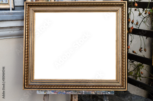 Ornate blank frame on the Easel in outside Art Gallery, White Isolated Clipping Path