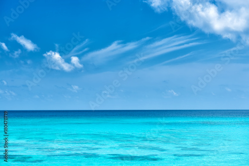 seychelles tropical turquoise water and cloudy blue sky