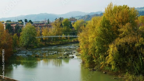 peaceful autumn river city tranquil landscape fall footbridge reno river Bologna - Casalecchio di Reno - Italy photo