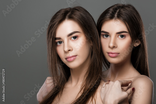 twins women with perfect skin and natural make-up 