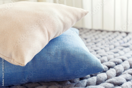 Grey knit giant plaid with pillows © fotofabrika