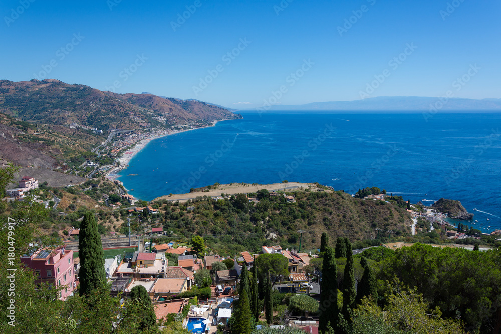panorama of the coast of Ionian sea from greek theater in Taormina  in a summer day
