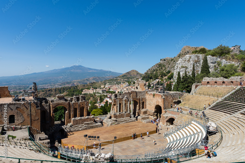 Greek theater in Taormina with the Etna volcano in the background, Sicily, Italy