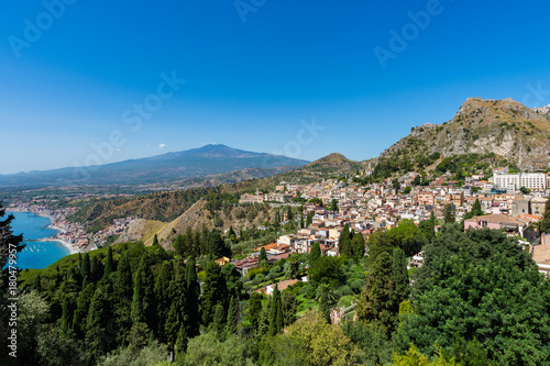 Taormina with the Etna volcano in the background seen from Greek theater  , Sicily, Italy