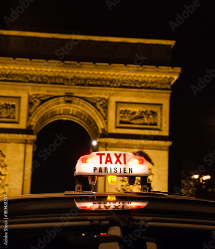 A Parisian taxi near Arc de Triomphe in Paris. 