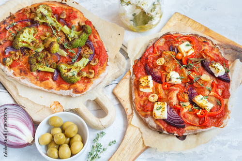 Homemade vegetarian vegetable pizza with feta cheese and broccoli.