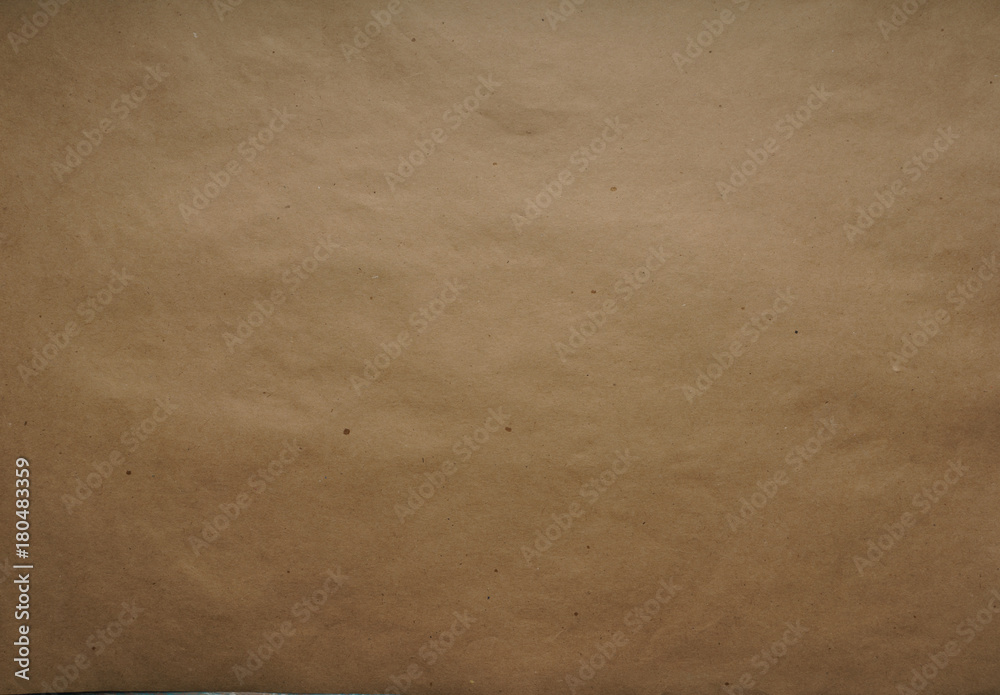 Kraft wrapping paper. Sheet. Brown color The texture. Top view, close-up 