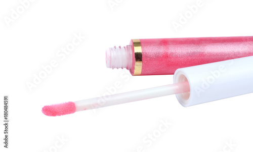 makeup cosmetics. fuchsia color lip gloss with glitter particles in glass bottle, closed and open container with brush and stroke sample, isolated on white background, clipping path included
