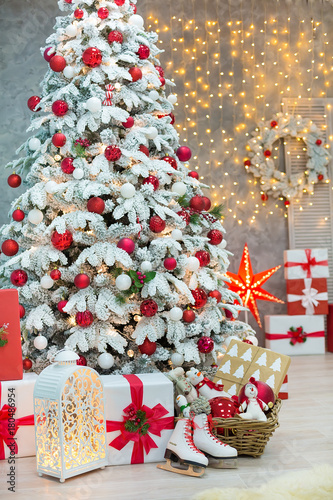 Christmas studio decorations wonderful idea mainly white and red New Year tree with snow and plenty presents under Amazing LED lights bake and huge paper star.