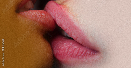 Lesbian lips together. Passionate kiss. Female lips closeup. Girls lesbians. Closeup of pair women mouths kissing. Homosexual couple love photo