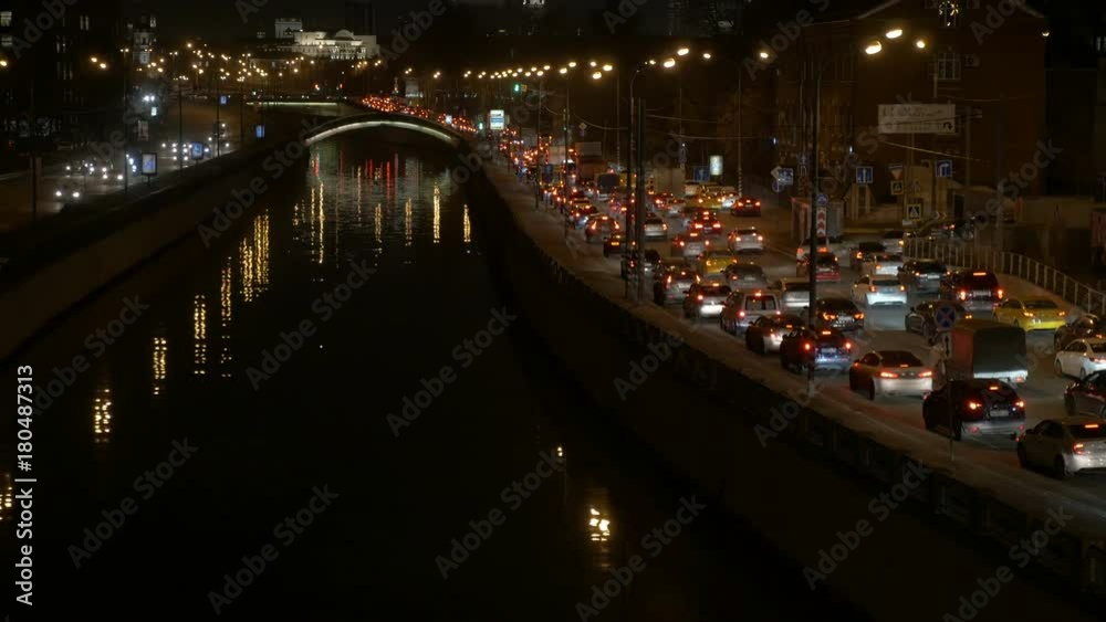 Motion of cars, in the evening through the streets of a large city. Motion of cars, in the evening through the streets of a large city.