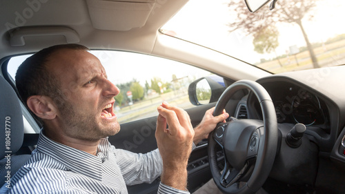 Fotografie Angry Italian driver gesturing funny, road rage theme