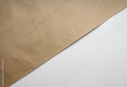 Composition of Kraft brown wrapping paper on white. Geometric background. Bright typographic design  Top view  close-up 