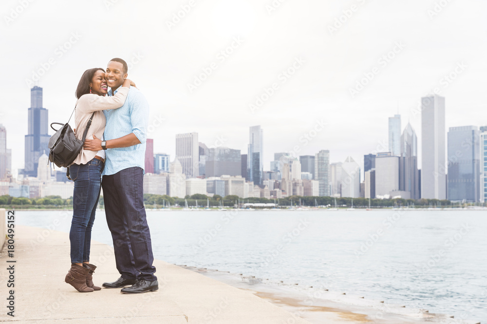 Happy black couple embracing in Chicago