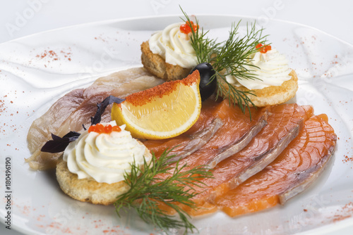 Appetizer of smoked salmon and herring