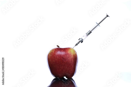 Genetically modified foods, apple pumped with chemicals