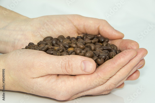 a hand full coffee on white backround