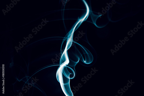 Swirls of blue smoke on a black background