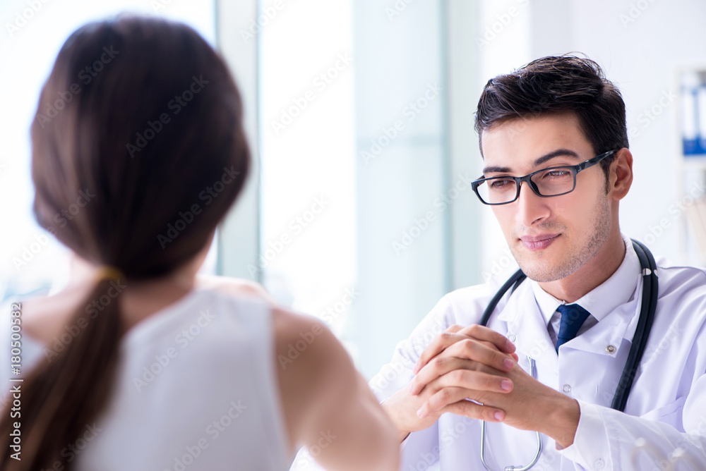 Obraz premium Woman with pet rabbit visiting vet doctor