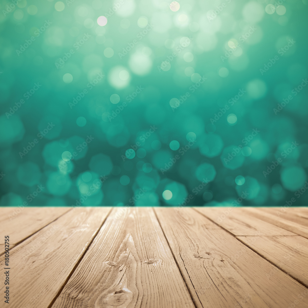 Christmas holiday background with rustic table over green bokeh for product montage Christmas holiday background with rustic table over green bokeh for product montage