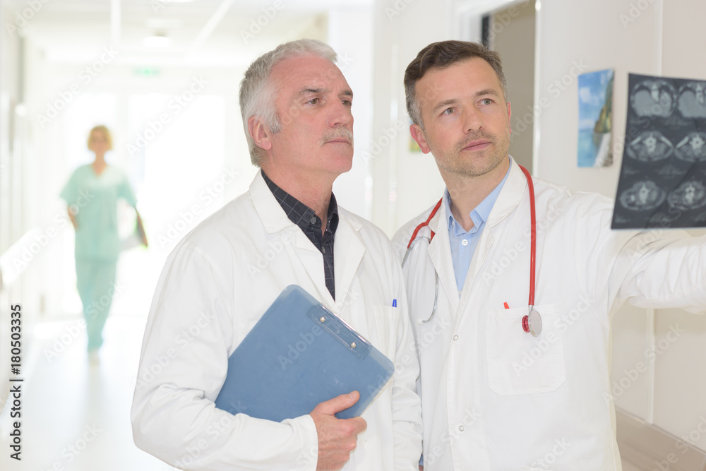 doctors examining the patient's examination result doctors examining the patient's examination result