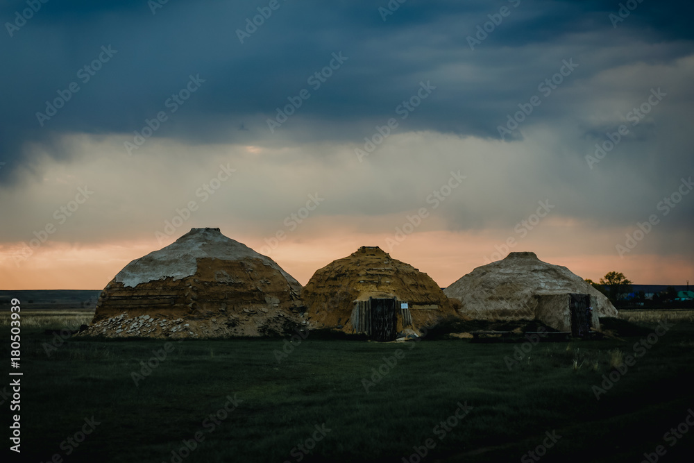 Three Yurts, standing alone on the field