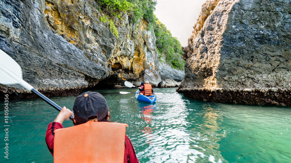 Fototapeta premium Group of tourists on a kayak.Travel by boat around Ko Phi enjoy the nature of the sea and islands in the summer at Mu Ko Ang Thong National Marine Park, Surat Thani province, Thailand ,16:9 widescreen