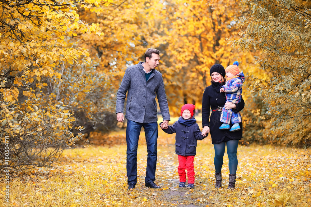 Family in autumn park in the afternoon Family in autumn park in the afternoon