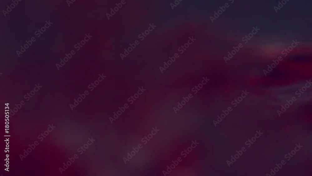Macro shot of red wine pouring into the bottom of a glass Macro shot of red wine pouring into the bottom of a glass