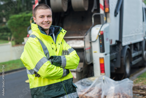 portrait of young smiling refuse collector photo