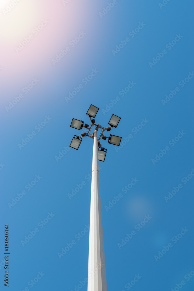 Lamppost on street with blue sky