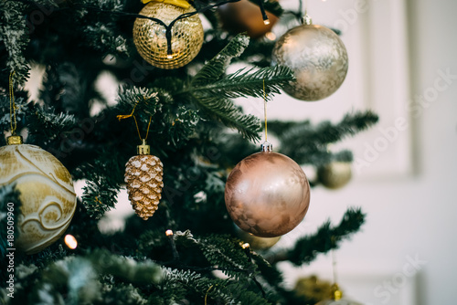 Christmas tree with toys, snowflakes and garland close-up