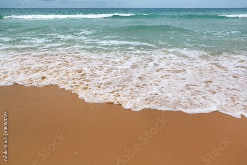 Landscape view of sea wave on the beach sand.