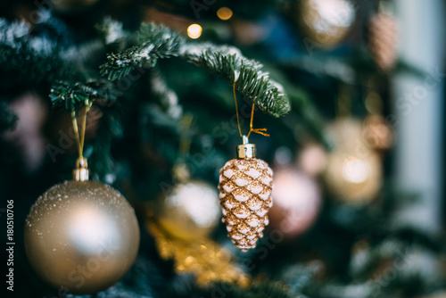 Christmas tree with toys, snowflakes and garland close-up