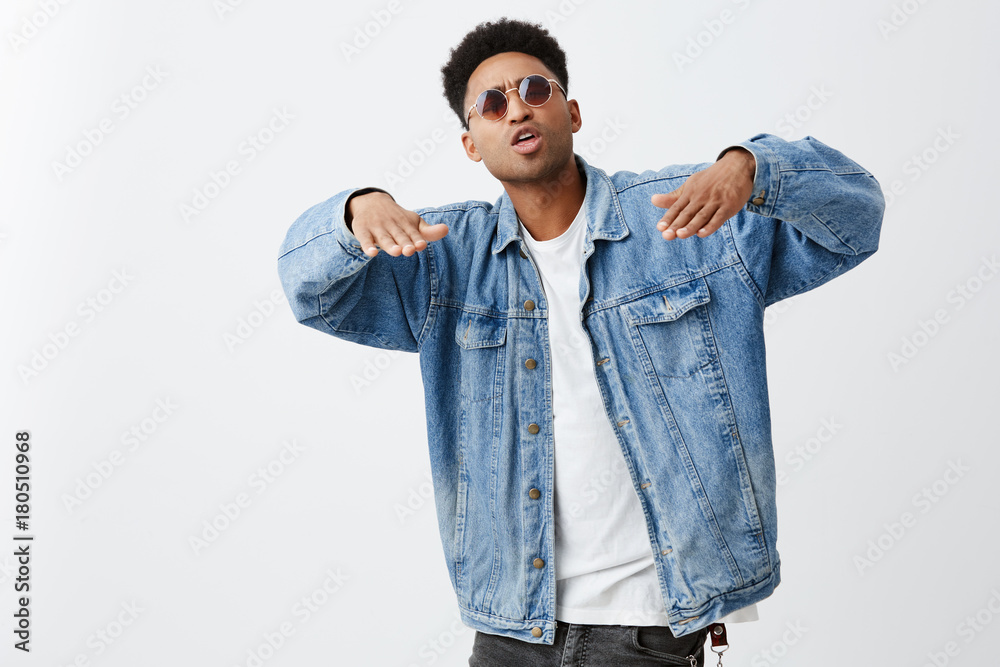 black-skinned man with dark curly hair 