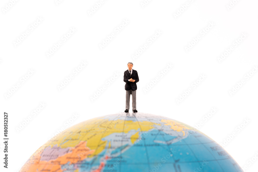 business miniature people standing on the globe isolated on white background business miniature people standing on the globe isolated on white background
